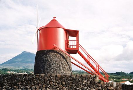 Cross Cultural Cuisine - a red tower sitting on top of a stone wall