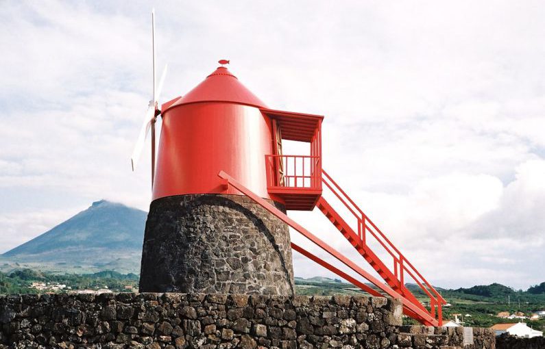Cross Cultural Cuisine - a red tower sitting on top of a stone wall
