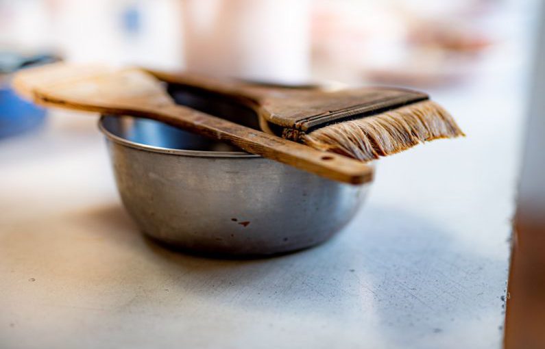 Baking Art - brown wooden fork on gray ceramic bowl