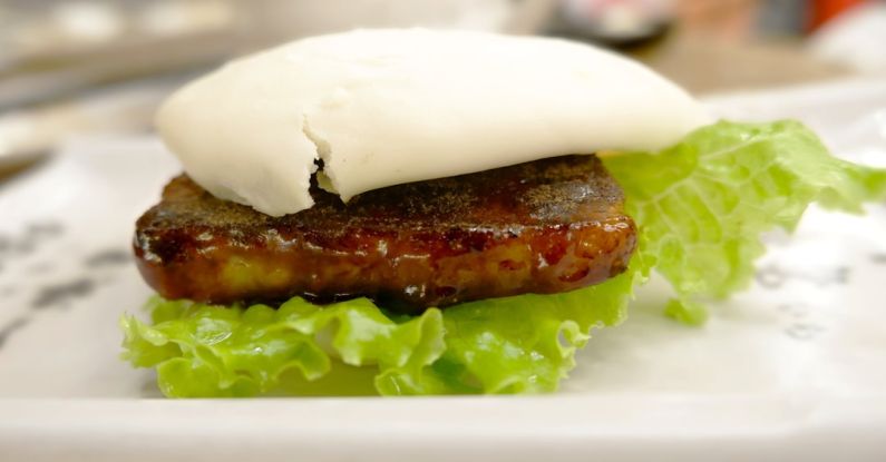 Fusion Cuisine - a close up of a plate of food with meat and lettuce