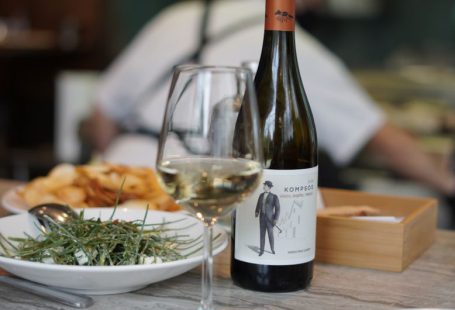 Greek Cuisine - wine bottle beside wine glass on table