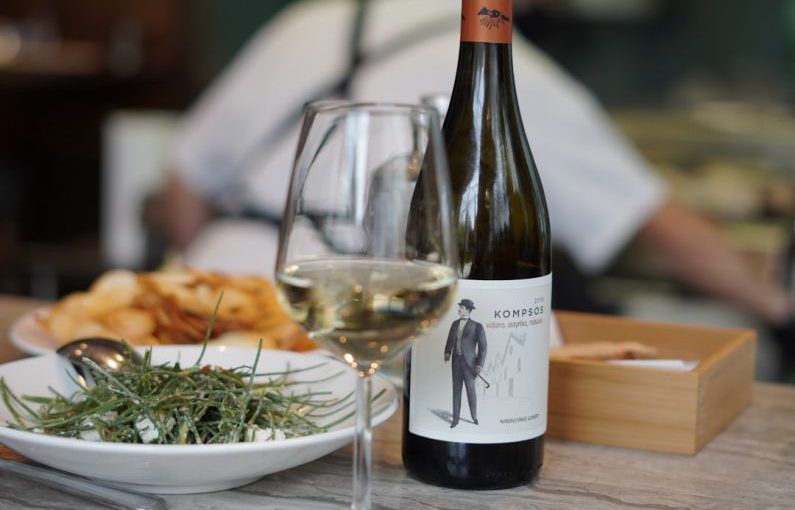 Greek Cuisine - wine bottle beside wine glass on table