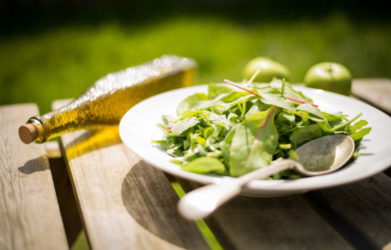 Tandoor Cuisine - green salad on white plate