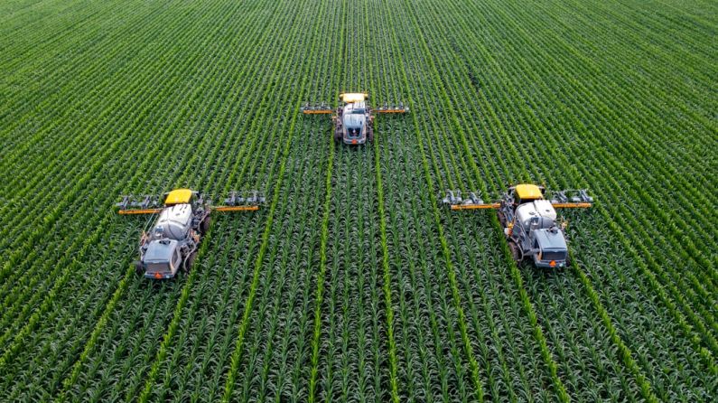 Smart Agriculture - yellow and black heavy equipment on green field during daytime