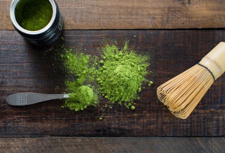 Matcha Tea - green powder and spoon on board