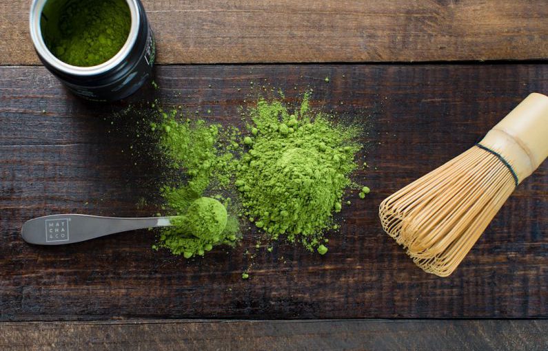 Matcha Tea - green powder and spoon on board
