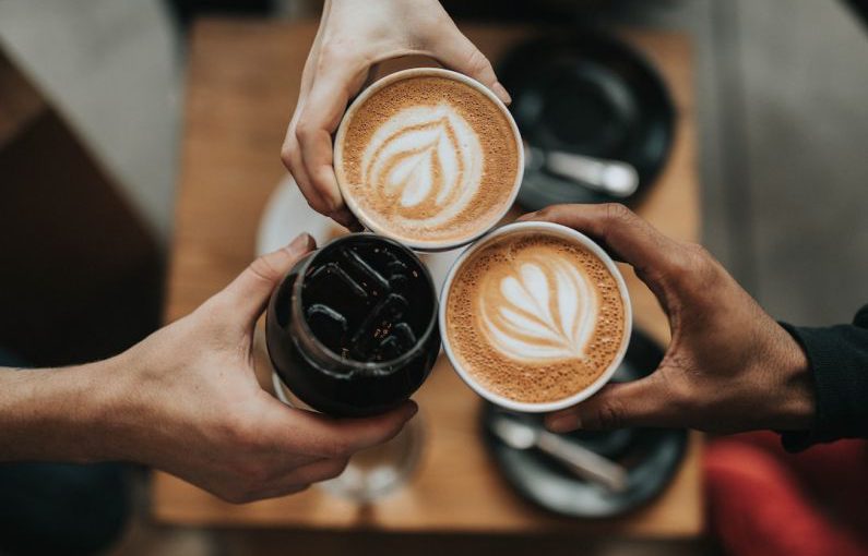 Functional Beverages - three person holding beverage cups