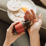 Probiotic Food - person holding red bottle