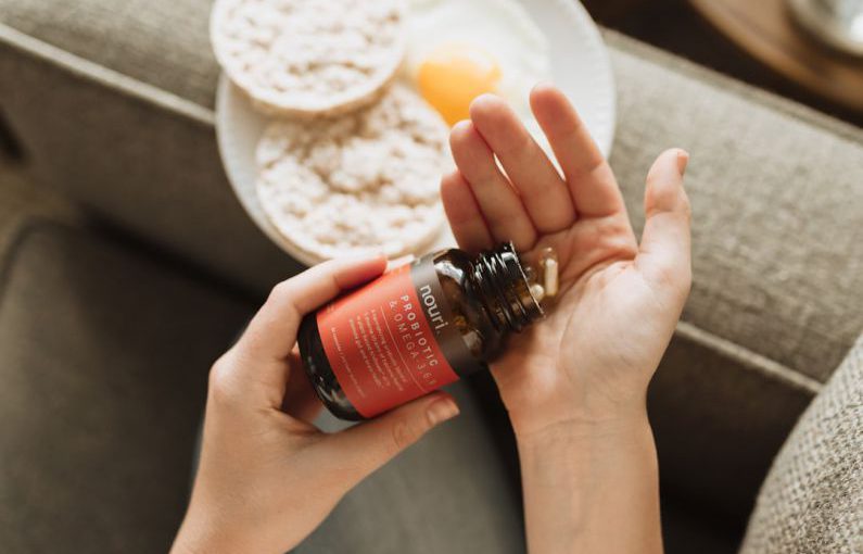 Probiotic Food - person holding red bottle