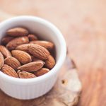 IoT Food - shallow focus photography of almonds in white ceramic bowl