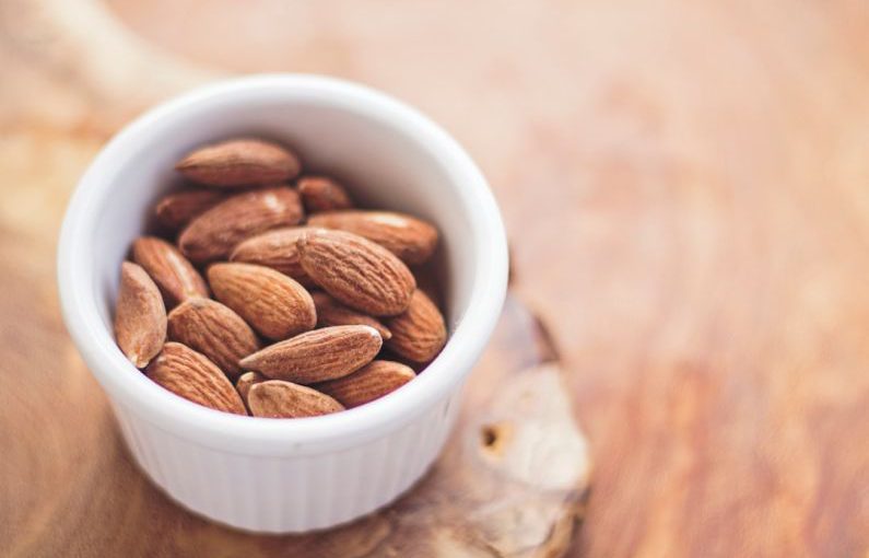 IoT Food - shallow focus photography of almonds in white ceramic bowl