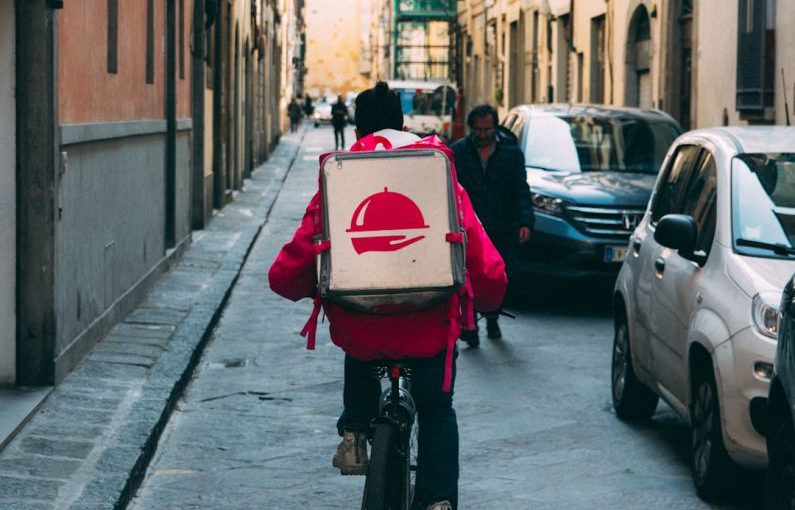 Food Delivery App - man riding a bicycle