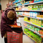Unmanned Supermarket - woman in brown leather jacket holding brown leather handbag