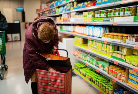 Unmanned Supermarket - woman in brown leather jacket holding brown leather handbag