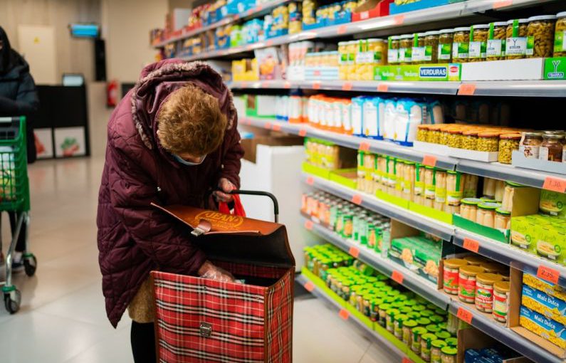 Unmanned Supermarket - woman in brown leather jacket holding brown leather handbag