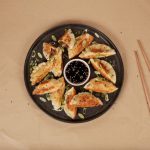 Cultured Meat Lab - a plate of food and chopsticks on a table