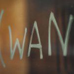 On-demand Farming - white letters on brown wooden table