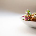 Food Plating - vegetable dish in white ceramic bowl