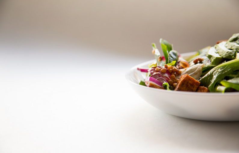 Food Plating - vegetable dish in white ceramic bowl